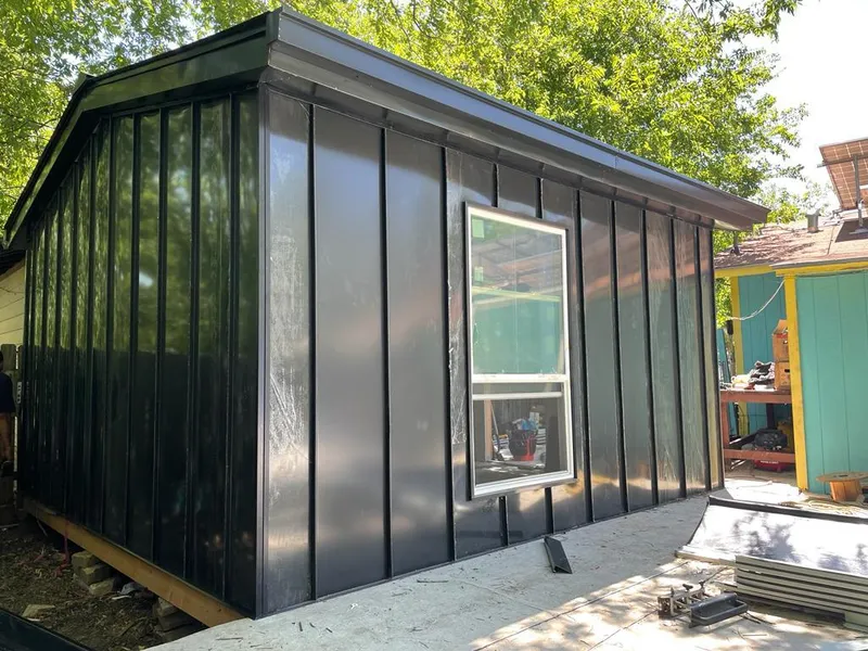 Black standing seam metal wall panels for Roof Inspection in Metropolis