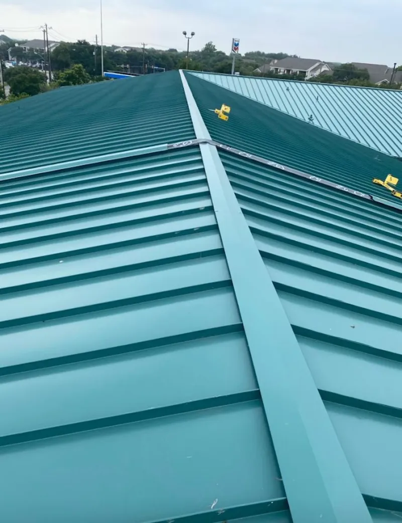 Green commercial metal roof ridge and valley for Metal Roof Repair in Metropolis